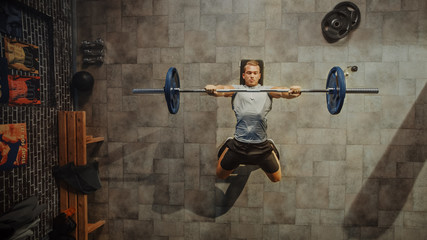 Top View Shot of Professional Athlete Doing Bench Press Workout with a Barbell in the Hardcore Gym....