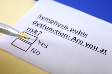 One person is decorated as a person answering question about symphysis pubis dysfunction.