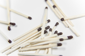 Matches with black heads on the white background