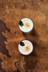 Yogurt on a wooden background. Summer food.