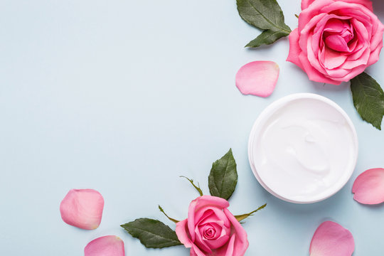 Natural Cosmetics cream. Organic Skin care product, rose buds and petals. Flat lay image, copy space