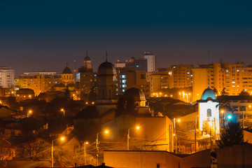 Naklejka premium Old city buildings in the dusk , The city of Ploiesti , Romania in the golden light