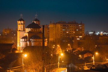 Fototapeta na wymiar Old city buildings in the dusk , The city of Ploiesti , Romania in the golden light