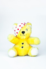 Bandaged eye teddy bear isolated on a white background. The concept of medicine and first aid