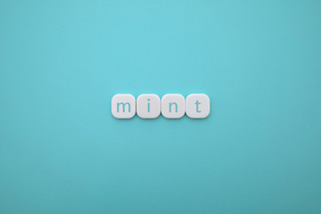 Alphabet MINT word block with MINT background.