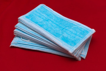 Close-up to face medical mask on red background