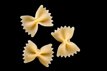 Fototapeta na wymiar farfalle pasta isolated on black or white background