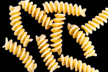Fototapeta premium fusili pasta isolated on a black or white background