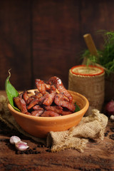 Deep fried pork made form sliced pork with sauce, garlics and pepper, Delicious cuisine served with sticky rice or steamed rice. Selective focus and free space for text. Yummy food good taste concept.