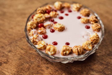 Yogurt on a wooden background. Summer food.