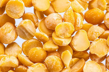 halves of crushed peas on a white background