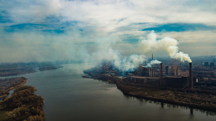 Fototapeta premium metallurgical production plant full cycle smoke from pipes bad ecology aerial photography