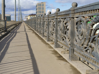 Photography of the pedestrian part of the bridge in Moscow. No people. Spring day. Coronavirus pandemic lifestyles.