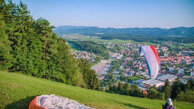 Recreational activity para glider flying over. Taking off from a mountain slope.