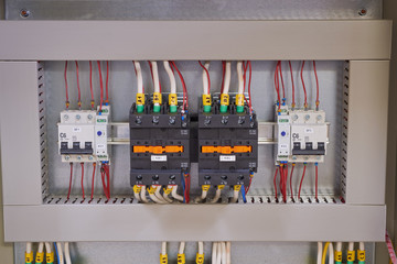 Two contactors or magnetic starters with mechanical locking, two circuit breakers and two phase...