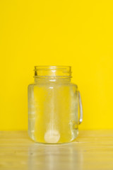 A tablet and a glass of water. Vitamin C