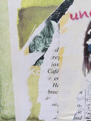 Close-up Of Torn Paper With Text On Wall