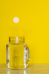 A tablet and a glass of water. Vitamin C