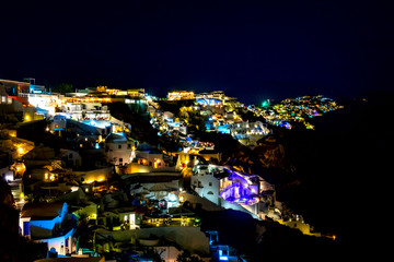 Fototapeta premium Night Illumination of Houses on the Santorini Caldera