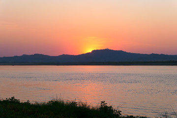 Fototapeta na wymiar Boat on the river during sunset.