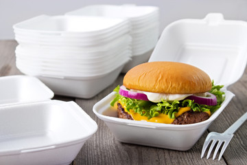 Disposable styrofoam burger boxes with cheeseburger - 338006969