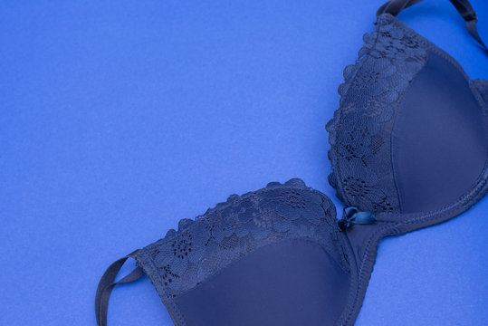 A classic blue bra close up on blue background. copy space