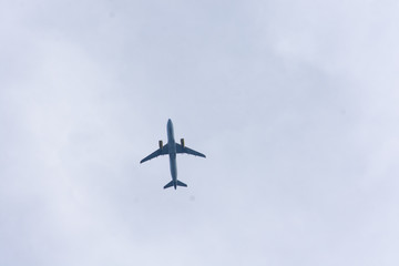 airplane flying over the blue sky
