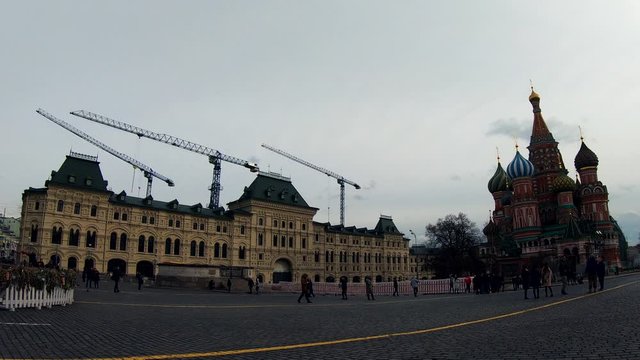 Red Square and the GUM Middle Trading Row building under tower cranes. Moscow Russia
