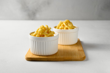 National food cuisine of the Middle East. Two ramekin with chak chak on a white table. Horizontal orientation