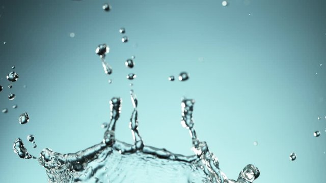Super slow motion of splashing water crown shape. Filmed on high speed cinema camera, 1000fps.