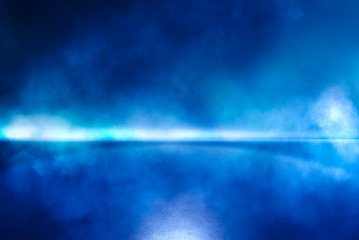 Abstract blue smoke studio background.