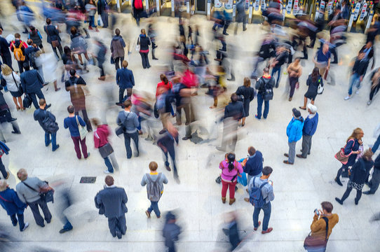 crowd of people at train station - blurred motion