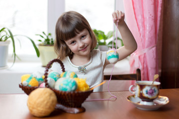 Little girl playing with easter eggs