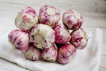 Garlic. Fresh garlic bulbs over white wooden rustic  background.