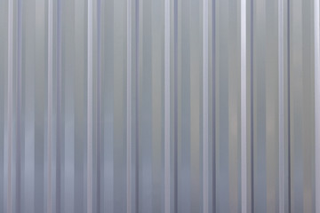 silver corrugate background and texture. grey metal sheet wall.