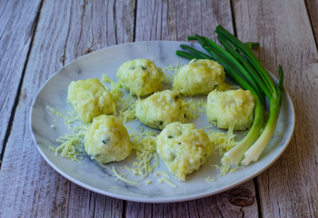 Boiled balls with cottage cheese, herbs and cheese