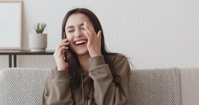 Self-isolated girl chatting with friends by mobile phone