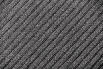 Black plisse background. geometric cloth lines. Fabric, textile close up.