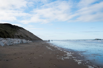 Fototapeta na wymiar An almost empty beach on the north antrim coast