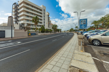 Obraz premium Las Americas,Tenerife, Spain March 21, 2020: Quiet, deserted streets of the most popular and crowded tourist resort in the Canary Islands. Isolation regimen during a coronavirus Covid-19 pandemic