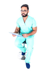 Handsome young paramedic (nurse) sitting and examining medical records, isolated on white background