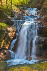 Fototapeta premium waterfall in autumn forest