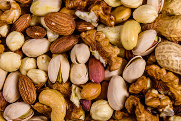 Background of the various nuts (almond, cashew, hazelnut, pistachio, walnut). Vegetarian meal. Healthy eating concept