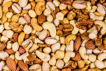 Background of the various nuts (almond, cashew, hazelnut, pistachio, walnut). Vegetarian meal. Healthy eating concept