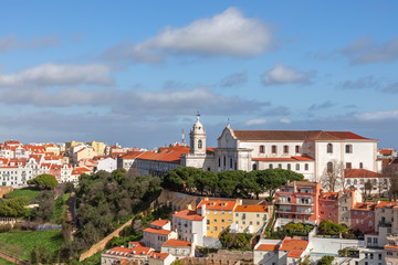 Fototapeta na wymiar Beautiful panoramic view of on Graca (Graça) hill with Nossa Senhora da Graca Church and Convent on the top. Lisbon, Portugal