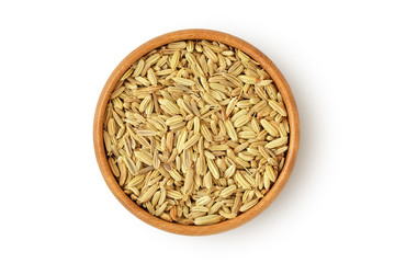 Fennel seeds in wooden bowl on white background