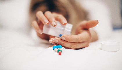 woman holding pills. COVID-19. Pills. Drug. Problem. 