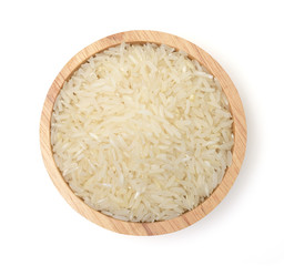 Uncooked dry rice (Milled rice) in wooden bowl isolated on white background,Healthy food,top view.