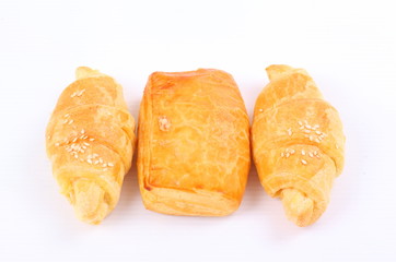 Fresh and tasty croissant on white background