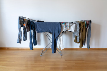 indoor balcony folding clothes drying rack in an empty room